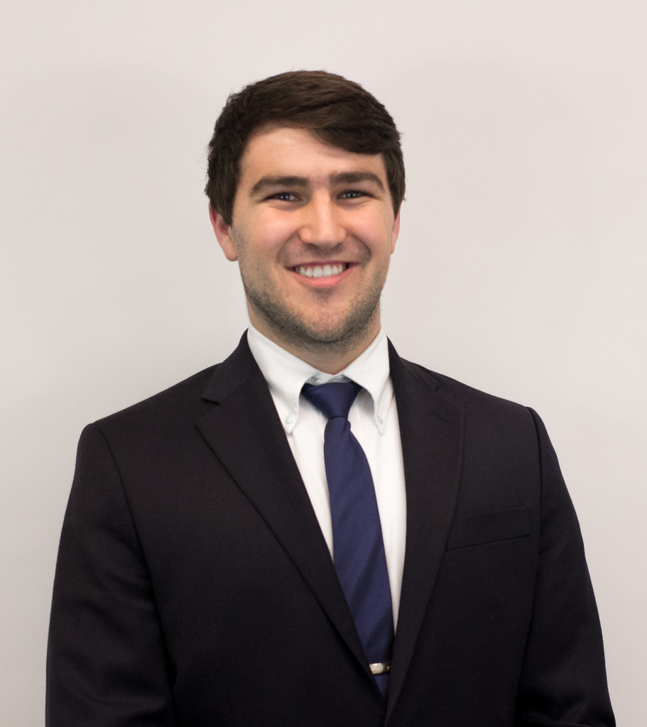 Man with brown hair in a suit